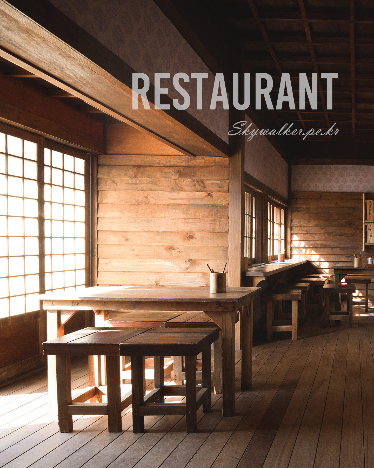 Restaurant - Sunlight streams through grid windows onto wooden tables and stools in a warm, quiet restaurant interior. - #Nonsan #SunshineLand #SunshineStudio #NonsanSunshineLand #NonsanSunshineStudio #Restaurant #KoreanRestaurant #RetroRestaurant #VintageKorea #RetroKorea