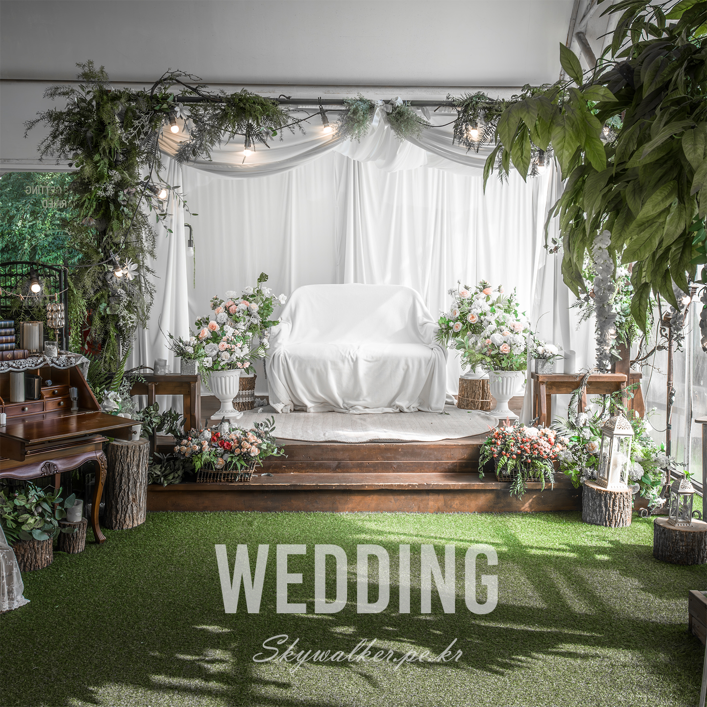 Wedding - A white-draped wedding photo set features a sofa, floral arrangements, greenery, warm bulbs, and soft daylight. - #wedding #weddingset #floraldecor #greenery #sofa #whitedrapes #softlight #indoorphotography #romanticdecor #photostudio